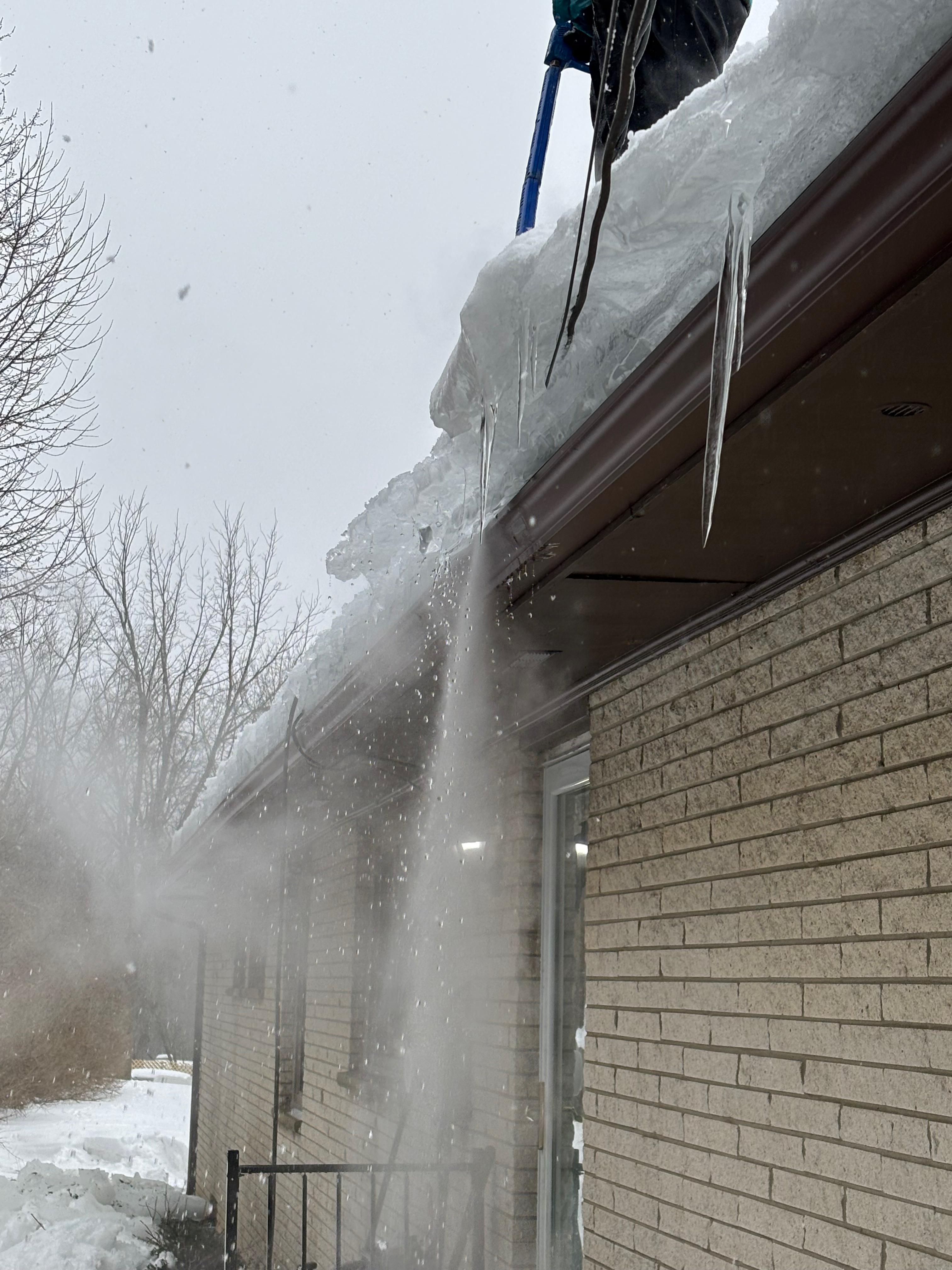 Ice dam removal in progress